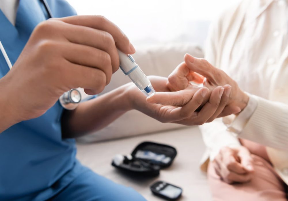 Doctor examining anatomical model of human body.