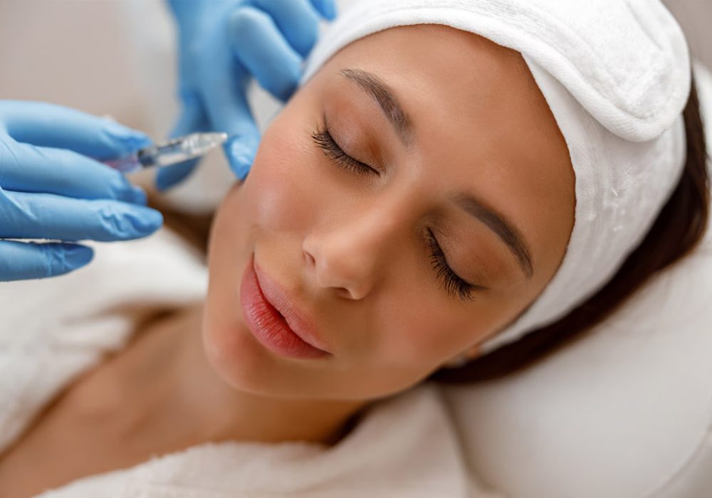 Doctor examining anatomical model of human body.
