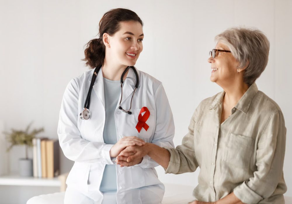 Doctor examining anatomical model of human body.